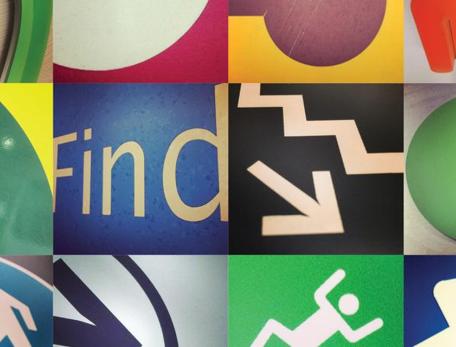 multicolored collage of wayfinding signs