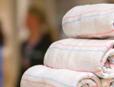 close-up of rolled pastel-striped baby blankets in a hospital 