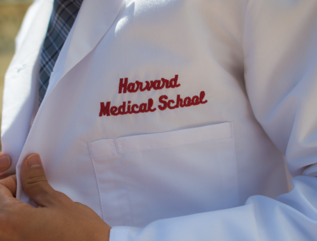 a person wearing a harvard medical school labcoat