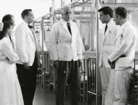 doctors in nurses standing and talking in a medical ward
