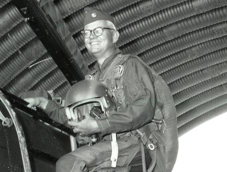 Close up of Royce Moser mounting an aircraft