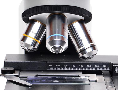 a microscope against a white background