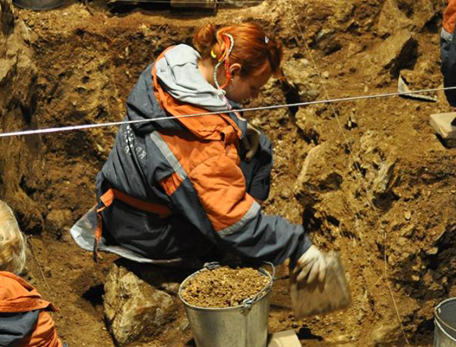 woman digging in a hole