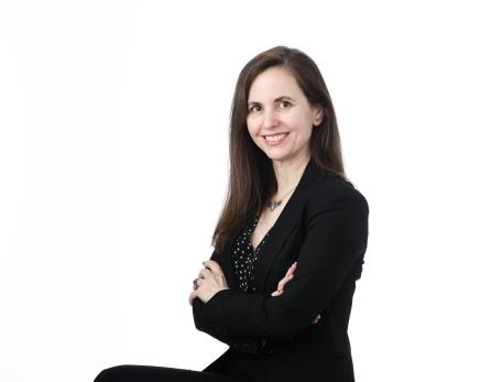 Jessica Whited sitting against a white background.