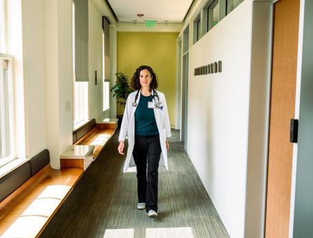 Ilana Yurkiewicz walking through the hallway at a clinic
