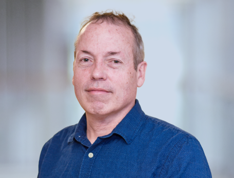 A headshot of David Ginty