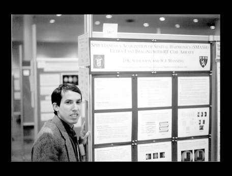 Daniel Sodickson in front of a scientific poster