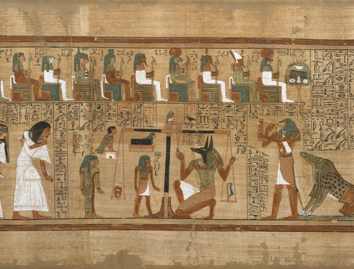 A papyrus scroll depicts a scene from the ancient Egyptian Book of the Dead in which a deceased person’s heart is weighed on a scale as the gods look on