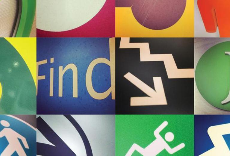 multicolored collage of wayfinding signs