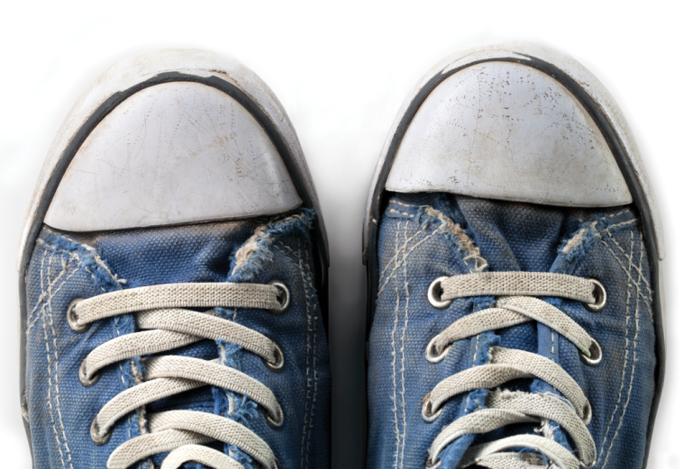 Two blue sneakers with white tips side-by-side