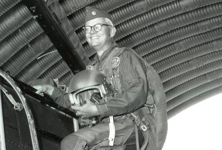 Close up of Royce Moser mounting an aircraft