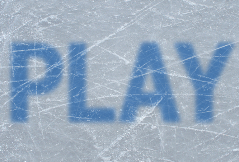 The word 'play' superimposed on ice
