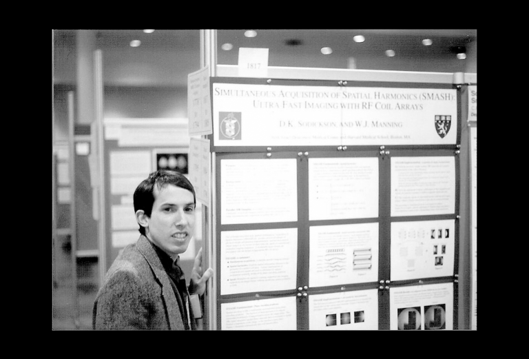 Daniel Sodickson in front of a scientific poster
