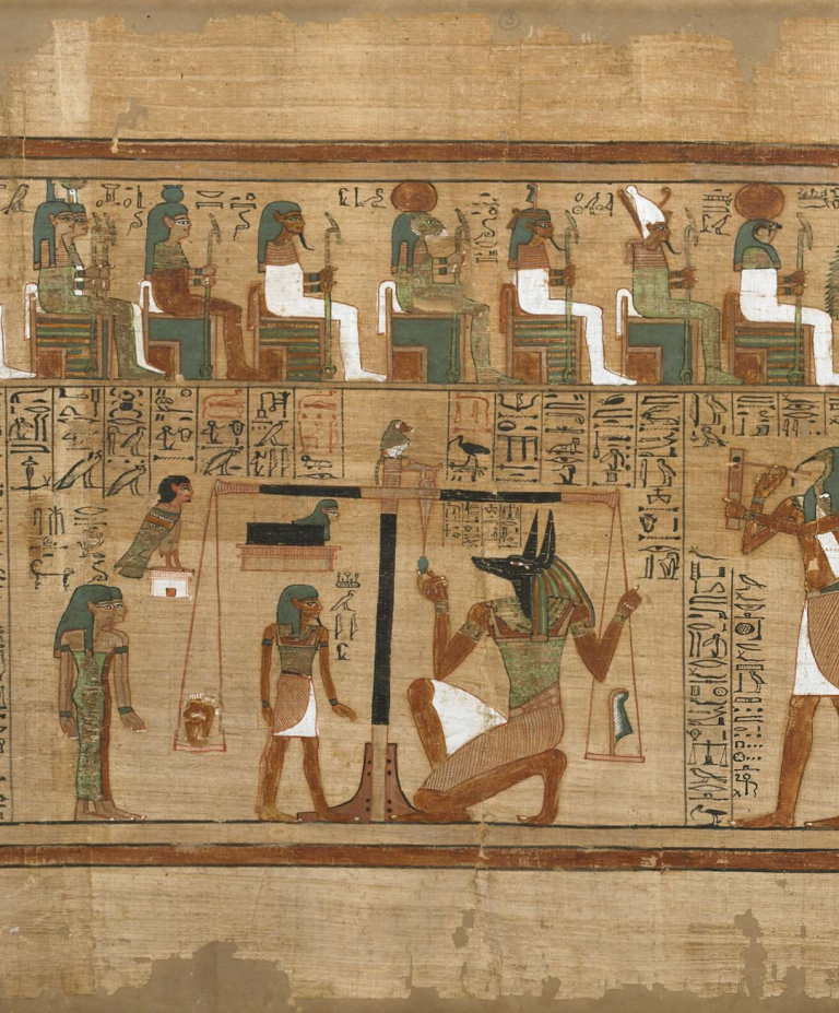A papyrus scroll depicts a scene from the ancient Egyptian Book of the Dead in which a deceased person’s heart is weighed on a scale as the gods look on