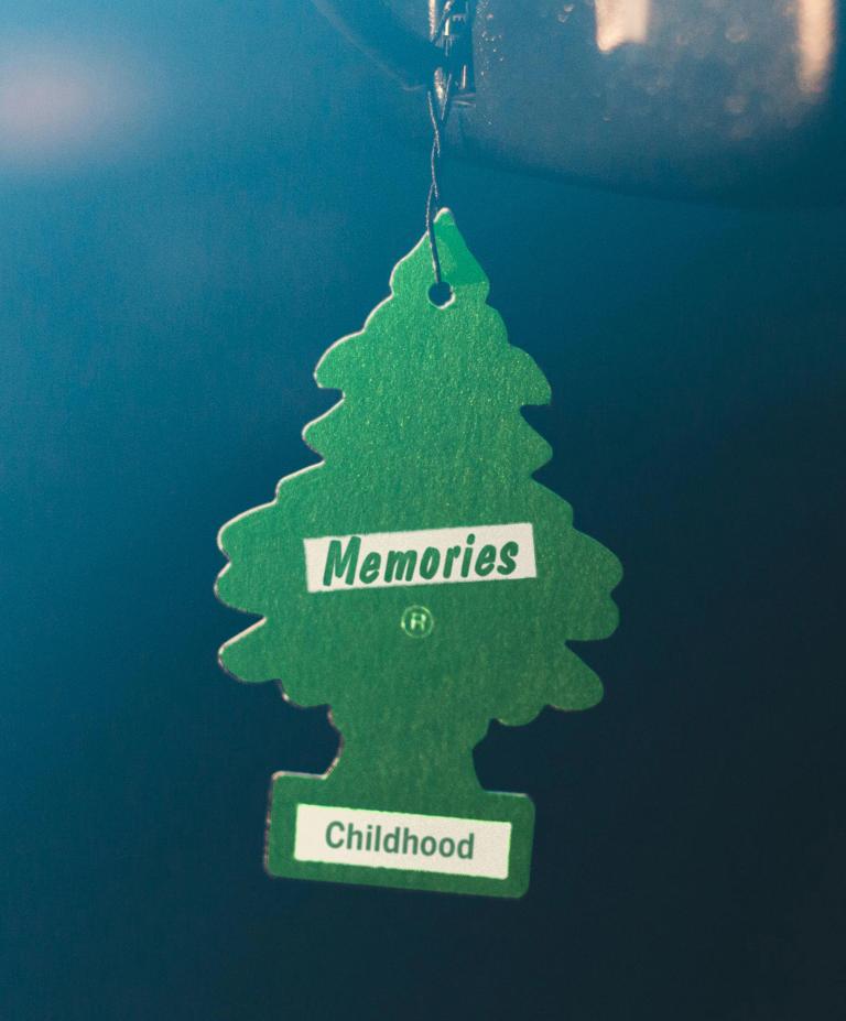 An air freshener labeled with the words "memories" and "childhood"