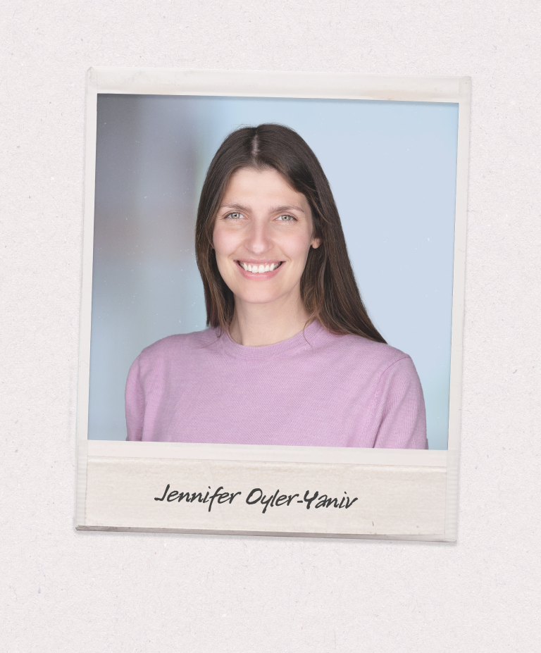 A headshot of a woman, Jennifer Oyler-Yaniv, in a pink shirt with straight brown hair, smiling at the camera. The photo is on a polaroid style background.