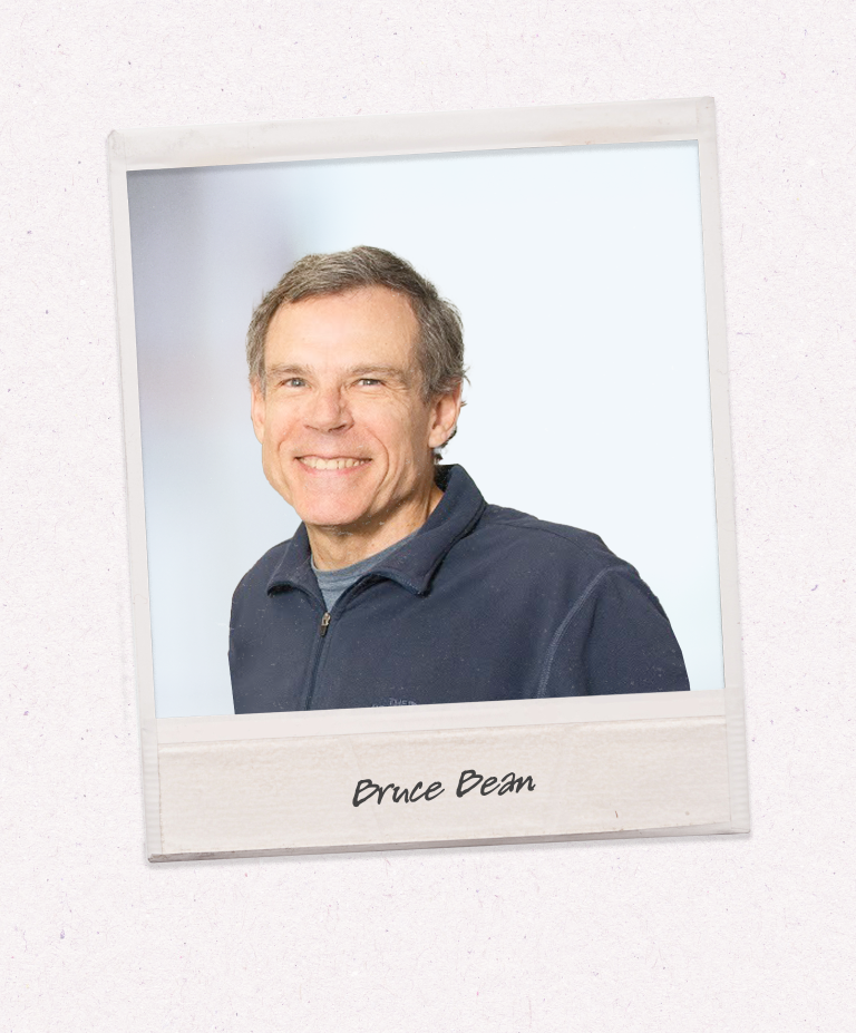 A headshot of Bruce Beam on a polaroid-style image against a beige background