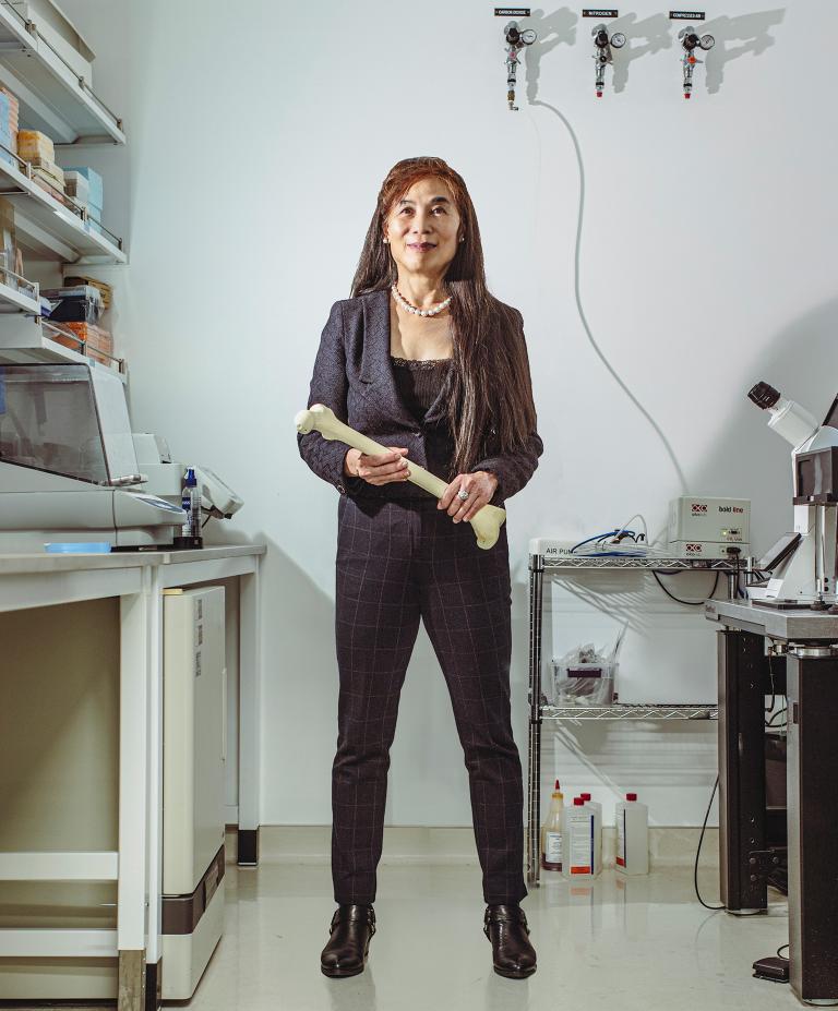 Constance Chu stands in a lab