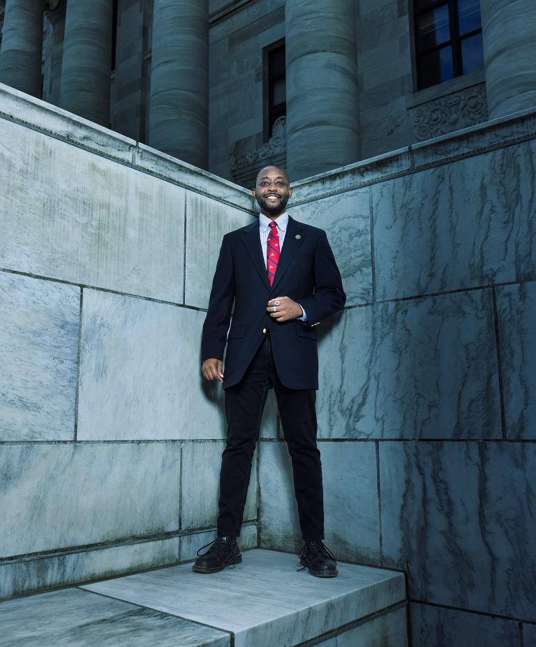 Lawrence Weru stands in front of Gordon Hall
