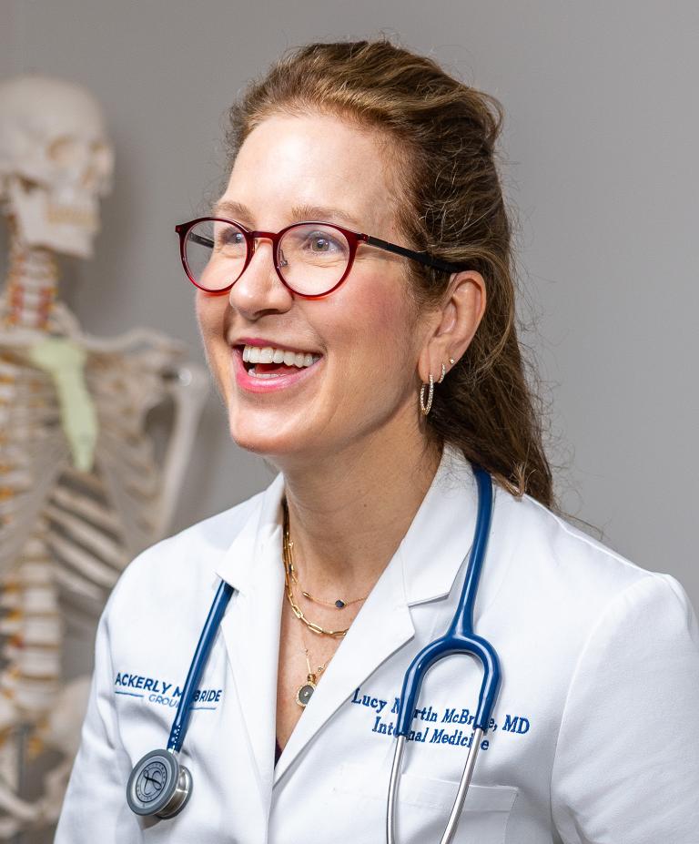 Headshot of Lucy McBride wearing a white coat