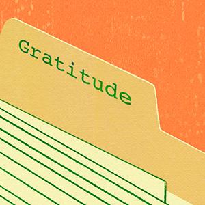 Closeup on manilla folder tab with the word "Gratitude"
