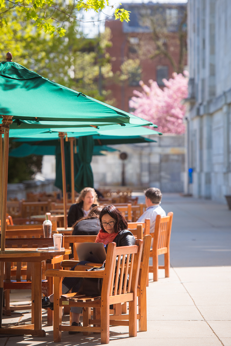 The tables and chairs along the wide sidewalks of the Quad were popular spots for work and conversation in pre-pandemic days.
