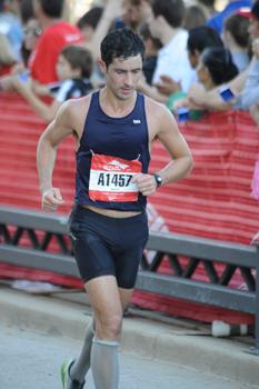 man running in a road race