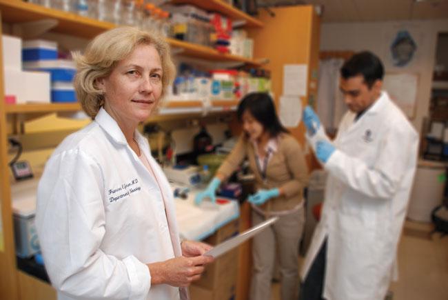 frances jensen in a white coat in a research labratory