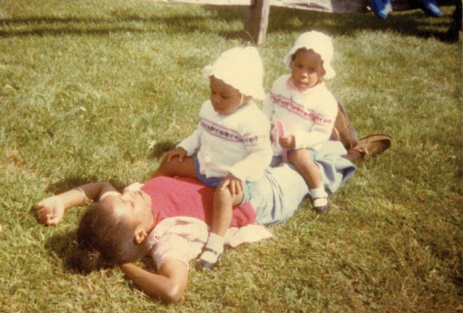 Dale with infants twins Oni, and Uché Blackstock playing outdoors