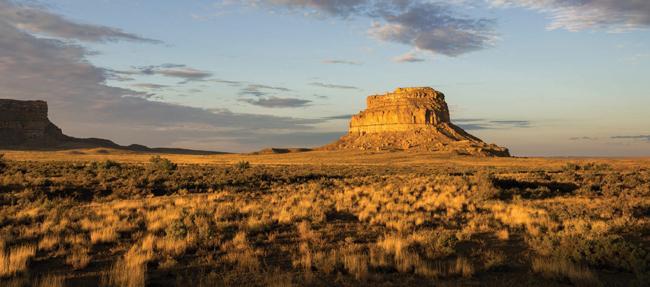 rock formation rising out of the brown desert