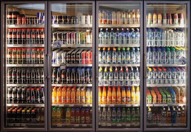 cooler of soda and juice in a store