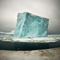 A piece of a glacier floats in the ocean