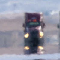 A truck seen in the distance through a filter of haze