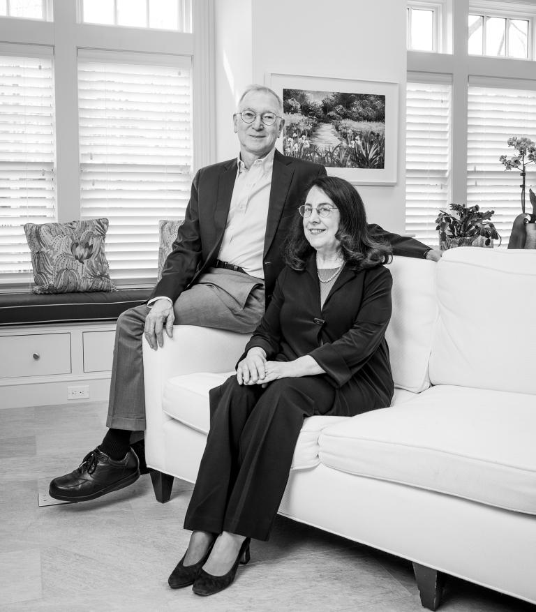 Gordon Freeman and Arlene Sharpe sitting on a couch.