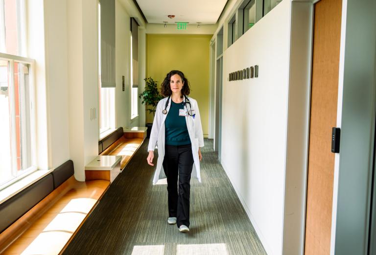 Ilana Yurkiewicz walking through the hallway at a clinic