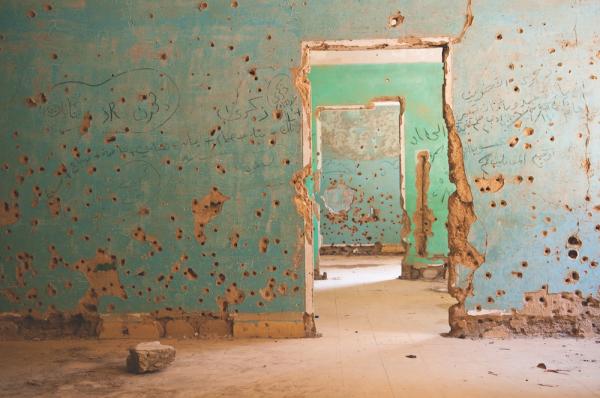 The writings on the walls of this abandoned hospital in southwestern Syria memorialize fighters and families who died during various conflicts.