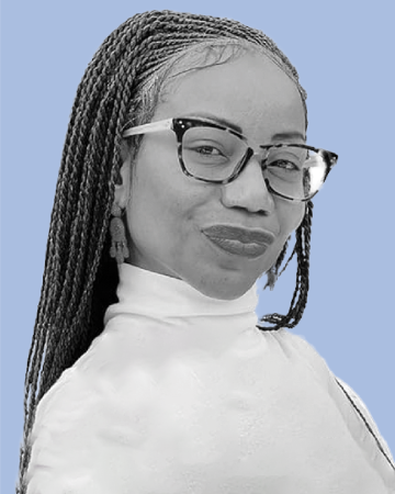 A woman with a white turtleneck and glasses smiles at the camera against a blue background.